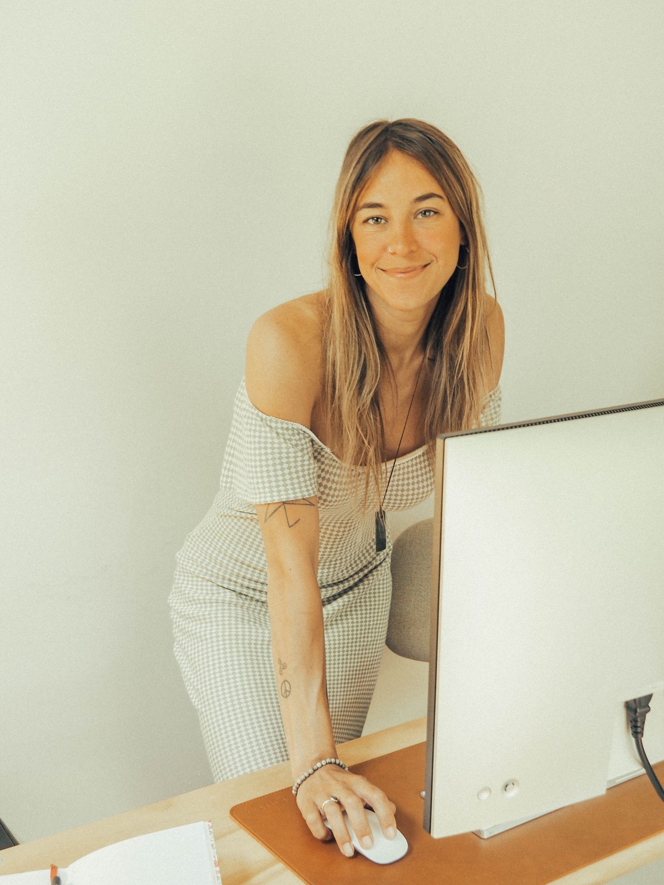 Barbara smiling at her desk