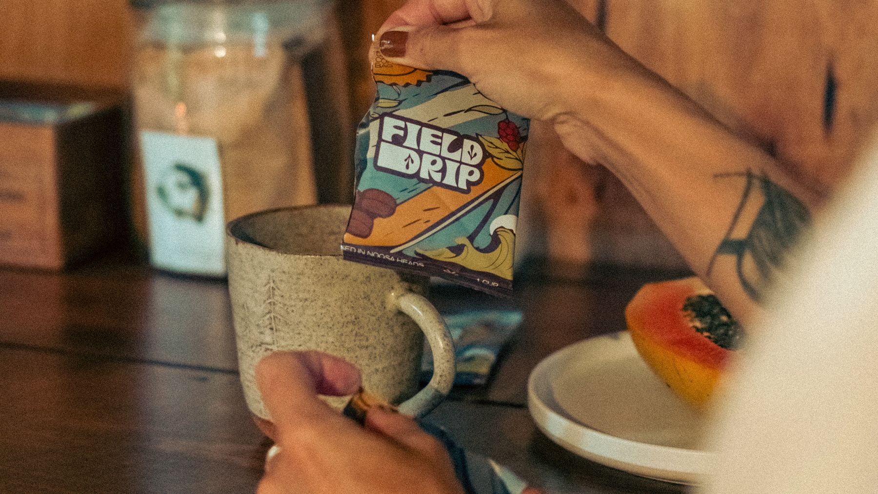 Opening a Field Drip sachet over a mug